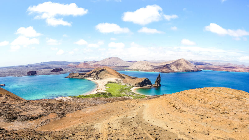 Panoramic view of " Isla Bartolome " at Galapagos Islands archipelago - Travel and wanderlust concept exploring world nature wonders around Ecuador - Vivid filter with warm bright color tones